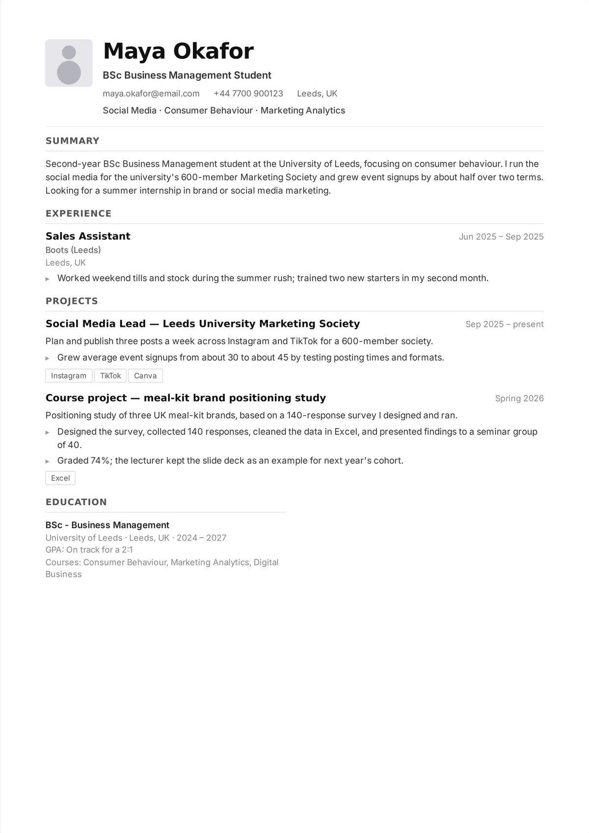 Student CV example — one-page CV of a second-year business student with education first, projects second, and a part-time job below them